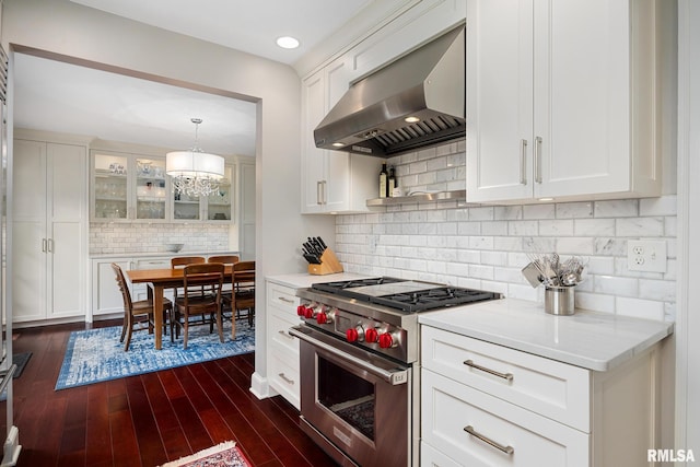 4407 N Grandview Dr, Peoria Heights, IL 61483 - kitchen with exhaust hood, designer stove, tasteful backsplash, white cabinets, and recessed lighting