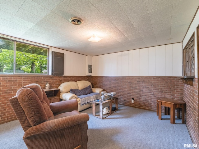1402 Lincoln Rd, Marquette Heights, IL 61554 - living room with carpet floors and brick wall
