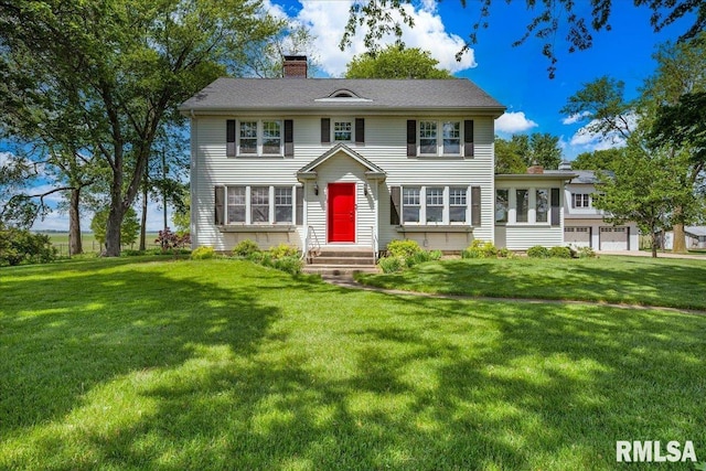701 E Pearl St, Tremont, IL 61568 - colonial inspired home with a chimney and a front lawn