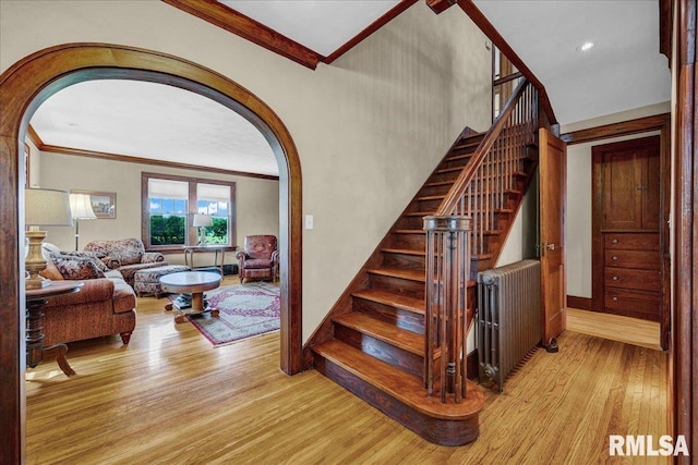 701 E Pearl St, Tremont, IL 61568 - stairs featuring arched walkways, ornamental molding, wood finished floors, and baseboards