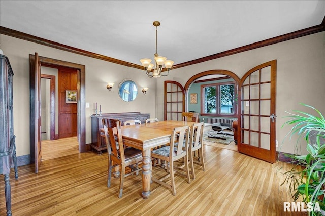 701 E Pearl St, Tremont, IL 61568 - dining area featuring light wood-style flooring, crown molding, a chandelier, and baseboards