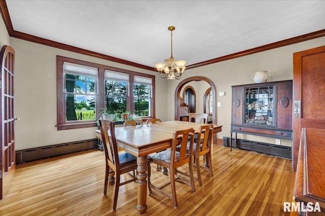 701 E Pearl St, Tremont, IL 61568 - dining area featuring baseboard heating, light wood finished floors, ornamental molding, arched walkways, and a chandelier