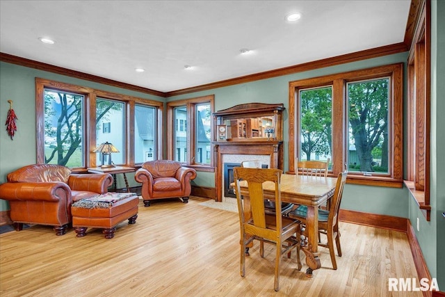 701 E Pearl St, Tremont, IL 61568 - dining area featuring baseboards, light wood-type flooring, healthy amount of natural light, ornamental molding, and recessed lighting