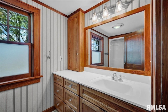 701 E Pearl St, Tremont, IL 61568 - bathroom featuring vanity, wallpapered walls, and crown molding