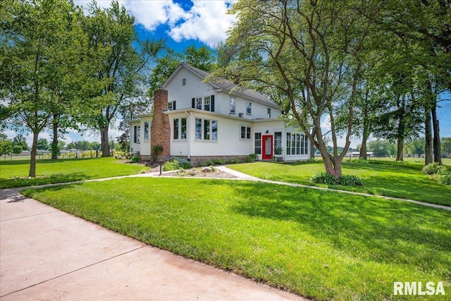 701 E Pearl St, Tremont, IL 61568 - view of front of house with a front yard and a chimney