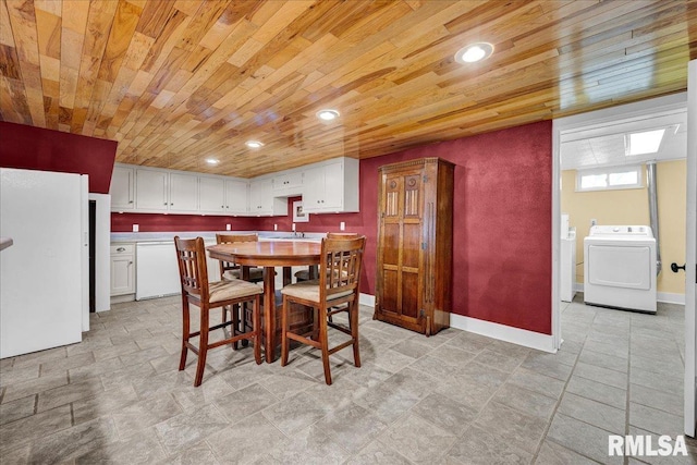 701 E Pearl St, Tremont, IL 61568 - dining room with independent washer and dryer, wood ceiling, baseboards, and recessed lighting
