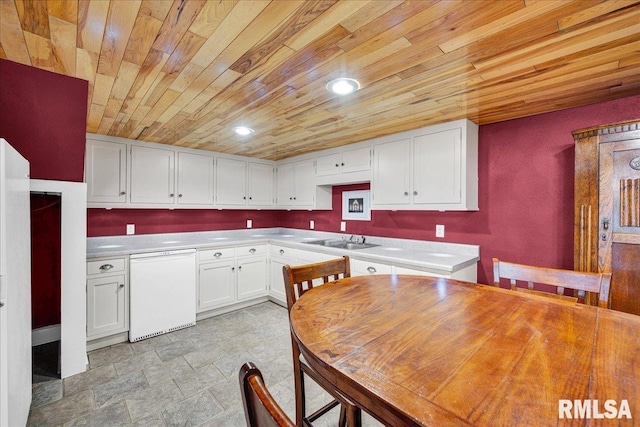 701 E Pearl St, Tremont, IL 61568 - kitchen featuring wood ceiling, dishwasher, a sink, white cabinets, and light countertops