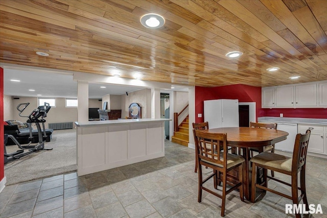 701 E Pearl St, Tremont, IL 61568 - dining room featuring wood ceiling, stairs, light stone finish flooring, recessed lighting, and radiator heating unit