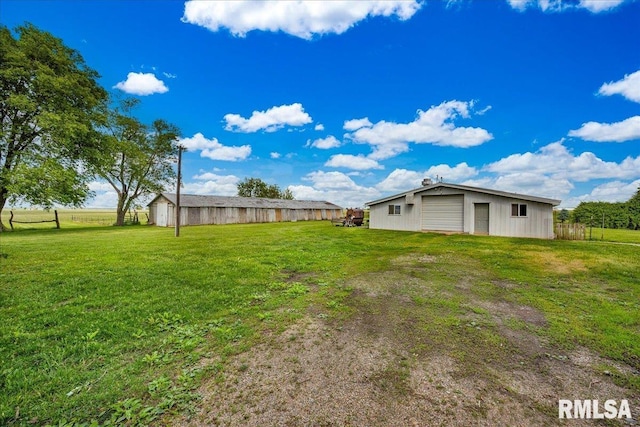 701 E Pearl St, Tremont, IL 61568 - view of yard with an outdoor structure and a garage
