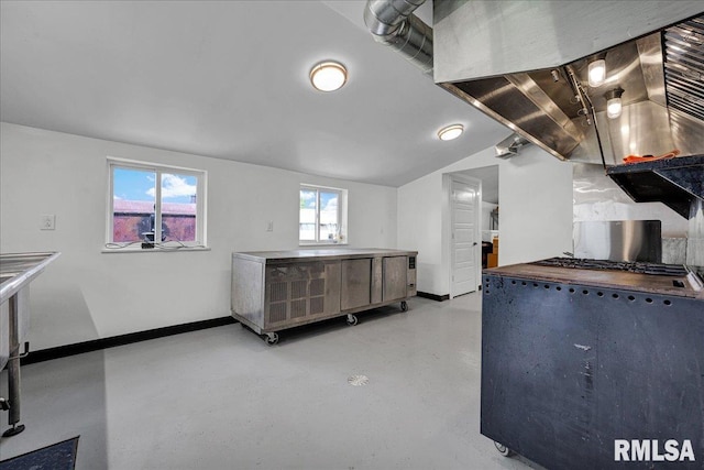 701 E Pearl St, Tremont, IL 61568 - kitchen with baseboards, concrete floors, and vaulted ceiling