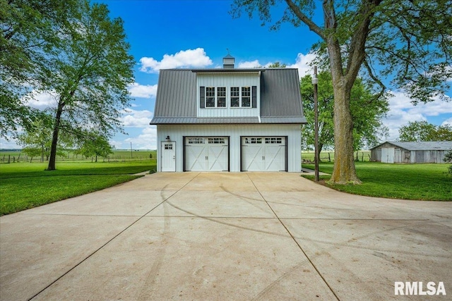 701 E Pearl St, Tremont, IL 61568 - view of property exterior featuring a lawn, metal roof, driveway, and a chimney