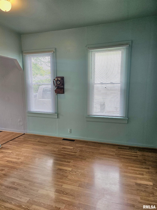 723 E Maywood Ave, Peoria, IL 61603 - empty room featuring wood finished floors