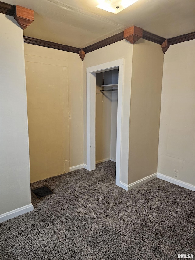 723 E Maywood Ave, Peoria, IL 61603 - unfurnished bedroom featuring ornamental molding, carpet flooring, a closet, and baseboards