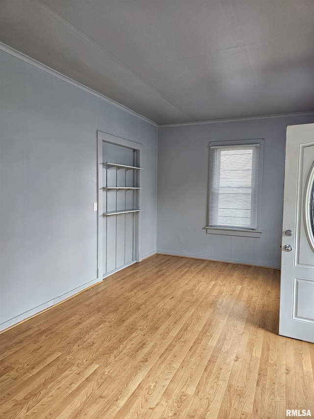 723 E Maywood Ave, Peoria, IL 61603 - unfurnished room with ornamental molding and wood finished floors