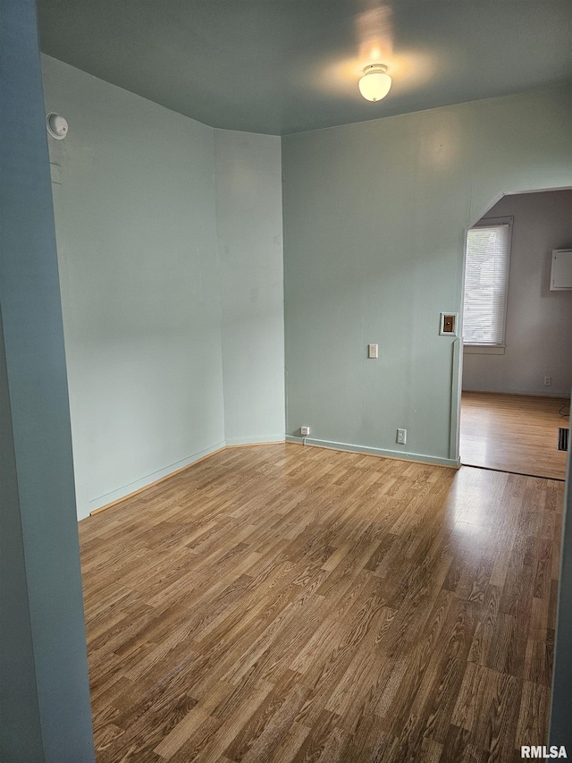 723 E Maywood Ave, Peoria, IL 61603 - empty room with wood finished floors and baseboards