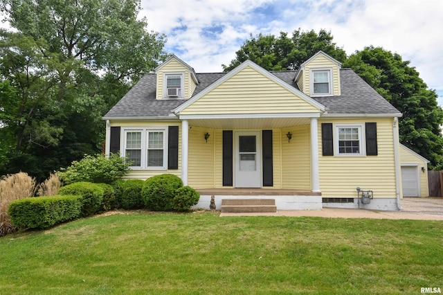 306 William St, East Peoria, IL 61611 - new england style home featuring roof with shingles, a porch, a front yard, and a garage