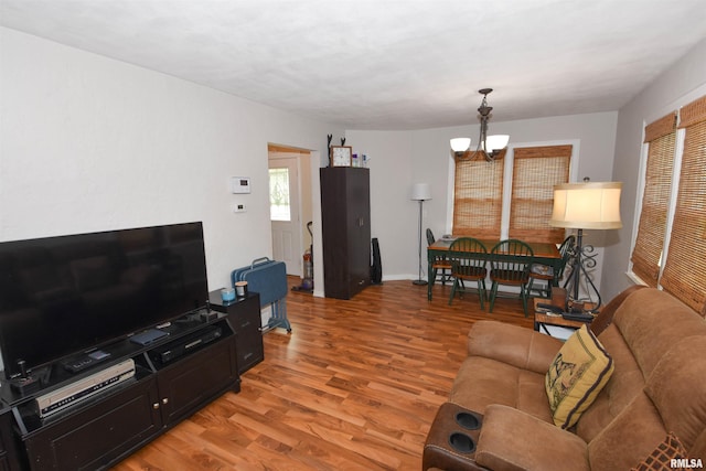 306 William St, East Peoria, IL 61611 - living area with a chandelier and light wood finished floors