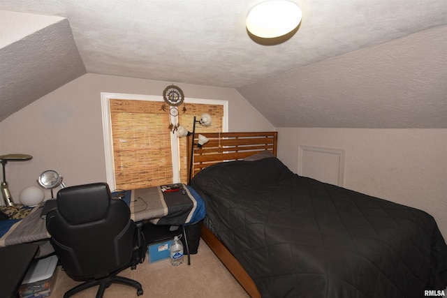 306 William St, East Peoria, IL 61611 - carpeted bedroom with vaulted ceiling, a textured ceiling, and a desk
