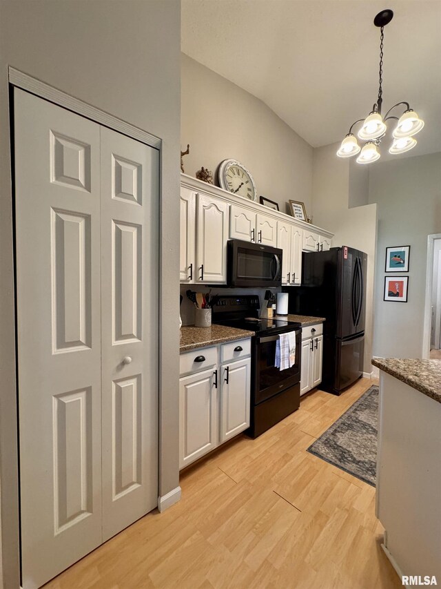 1041 Hawthorn Rdg, Macomb, IL 61455 - kitchen featuring black appliances, white cabinets, a chandelier, light wood-type flooring, and decorative light fixtures