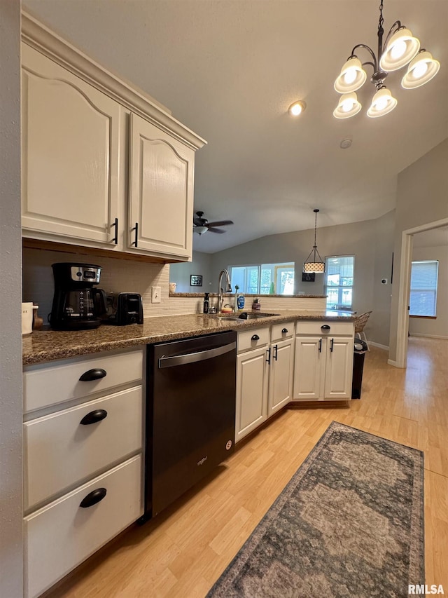 1041 Hawthorn Rdg, Macomb, IL 61455 - kitchen featuring dishwasher, a sink, light wood-type flooring, vaulted ceiling, and decorative light fixtures