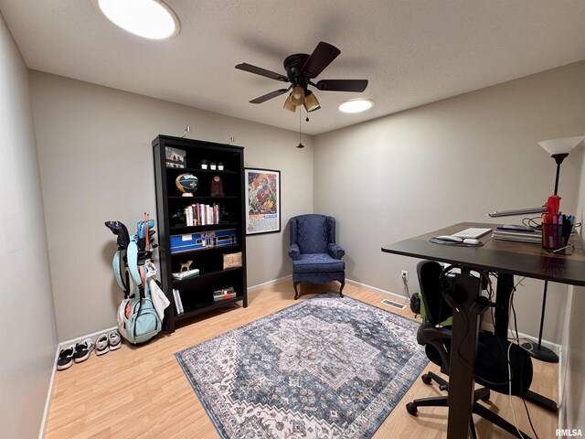 1041 Hawthorn Rdg, Macomb, IL 61455 - office space featuring ceiling fan, wood finished floors, and baseboards