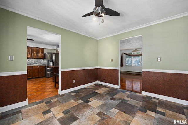 4517 W Hetherwood Dr, Peoria, IL 61615 - unfurnished room featuring a ceiling fan, ornamental molding, stone tile flooring, and baseboards