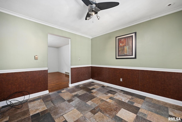 4517 W Hetherwood Dr, Peoria, IL 61615 - unfurnished room featuring a ceiling fan, stone tile flooring, baseboards, and ornamental molding