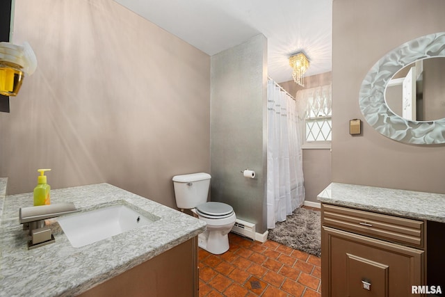 4517 W Hetherwood Dr, Peoria, IL 61615 - full bath with vanity, a baseboard heating unit, toilet, tile patterned flooring, and a shower with curtain