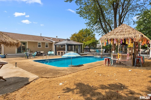 4517 W Hetherwood Dr, Peoria, IL 61615 - swimming pool with a gazebo, a patio area, and grilling area