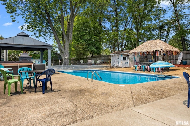 4517 W Hetherwood Dr, Peoria, IL 61615 - community pool with a gazebo, a fenced backyard, a patio area, and an outbuilding