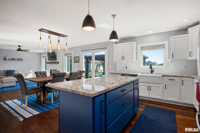 11414 N Joseph St, Dunlap, IL 61525 - kitchen featuring a sink, open floor plan, blue cabinets, white cabinets, and recessed lighting