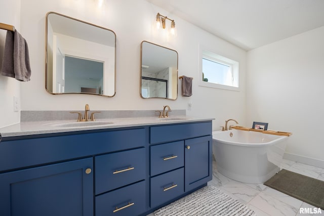 11414 N Joseph St, Dunlap, IL 61525 - full bathroom featuring marble finish floors, double vanity, a freestanding tub, a shower, and baseboards