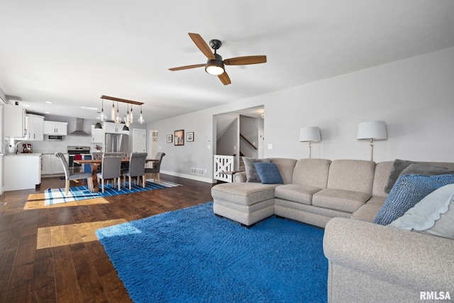 11414 N Joseph St, Dunlap, IL 61525 - living area with a ceiling fan, stairs, dark wood finished floors, and baseboards