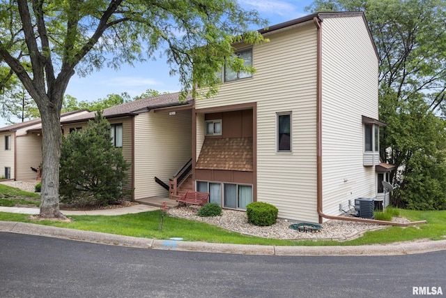 6500 N Allen Rd Unit 62, Peoria, IL 61614 - view of front facade featuring stairway and central air condition unit