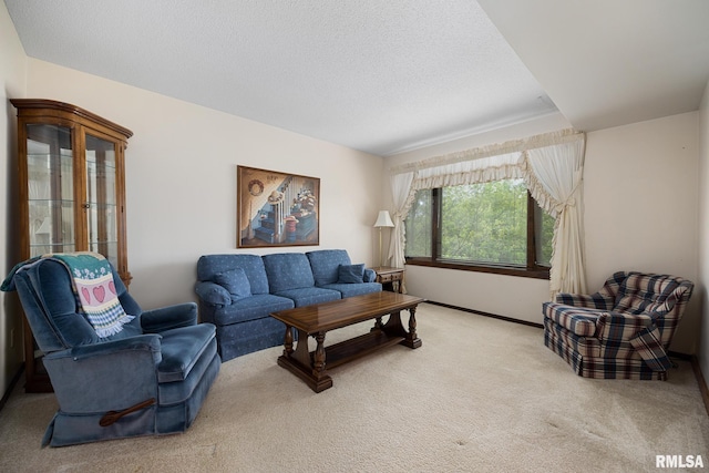 6500 N Allen Rd Unit 62, Peoria, IL 61614 - living area with light colored carpet, a textured ceiling, and baseboards