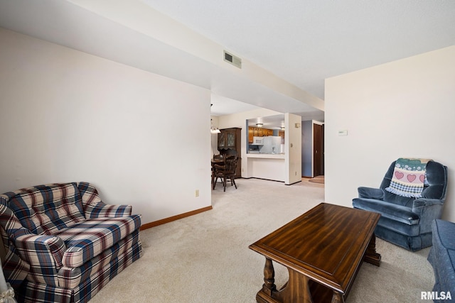 6500 N Allen Rd Unit 62, Peoria, IL 61614 - living room with light carpet and baseboards