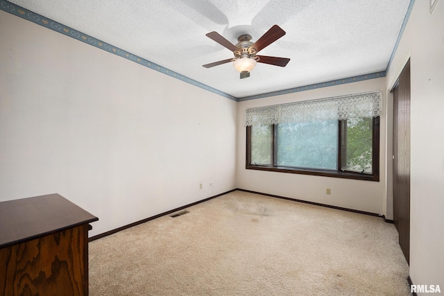 6500 N Allen Rd Unit 62, Peoria, IL 61614 - carpeted empty room featuring a textured ceiling, ceiling fan, and baseboards