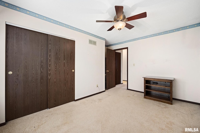 6500 N Allen Rd Unit 62, Peoria, IL 61614 - unfurnished bedroom featuring light carpet, a closet, baseboards, and ceiling fan