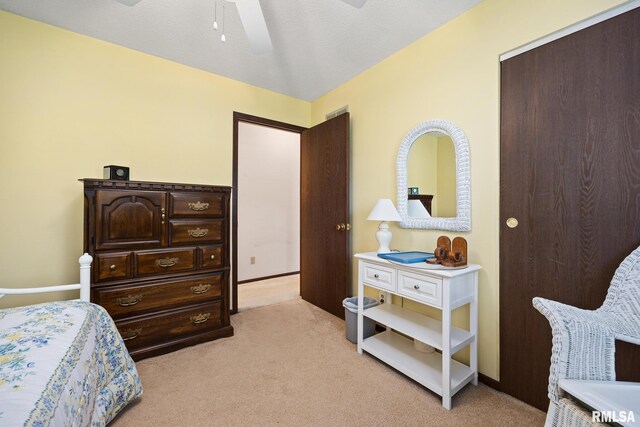 6500 N Allen Rd Unit 62, Peoria, IL 61614 - bedroom featuring light colored carpet, a closet, and a ceiling fan