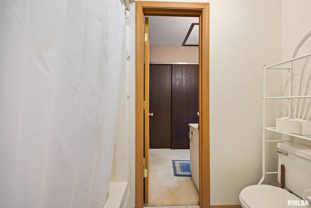 6500 N Allen Rd Unit 62, Peoria, IL 61614 - bathroom with toilet, a textured ceiling, vanity, and shower / bath combo with shower curtain