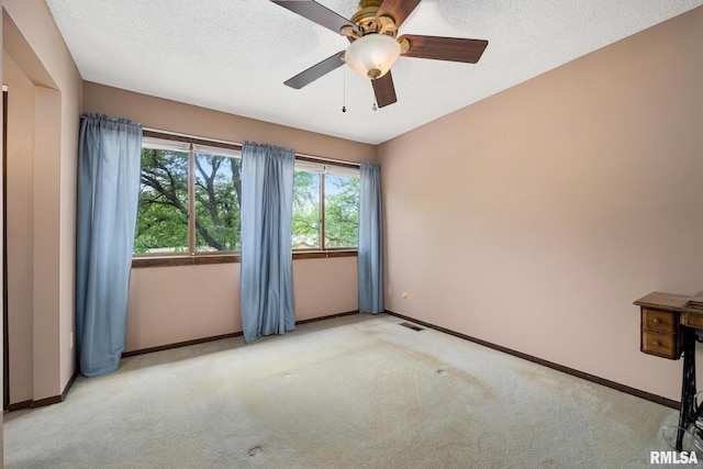 6500 N Allen Rd Unit 62, Peoria, IL 61614 - unfurnished room featuring carpet floors, baseboards, ceiling fan, and a textured ceiling