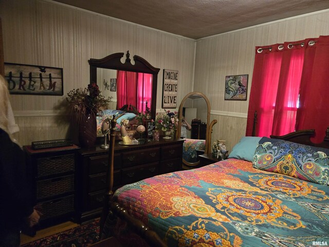 16324 E Cherokee Rd, Cuba, IL 61427 - bedroom with wooden walls and crown molding