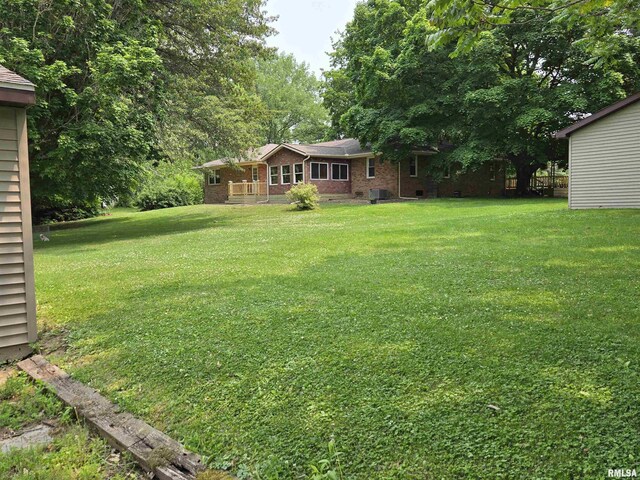 16324 E Cherokee Rd, Cuba, IL 61427 - view of grassy yard featuring central air condition unit