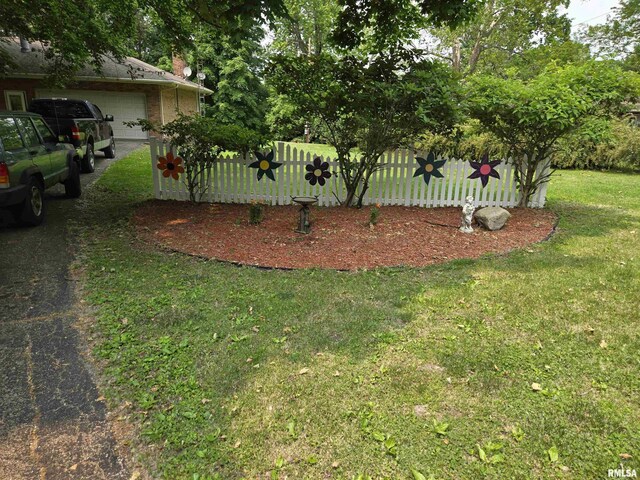 16324 E Cherokee Rd, Cuba, IL 61427 - view of yard with an attached garage