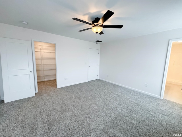 4014 W Fiona Way, Dunlap, IL 61525 - unfurnished bedroom with carpet floors, a walk in closet, ceiling fan, and a closet