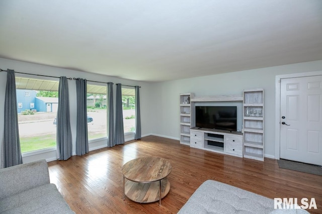 5232 N Merrimac Ave, Peoria, IL 61614 - living room featuring wood finished floors, plenty of natural light, and baseboards