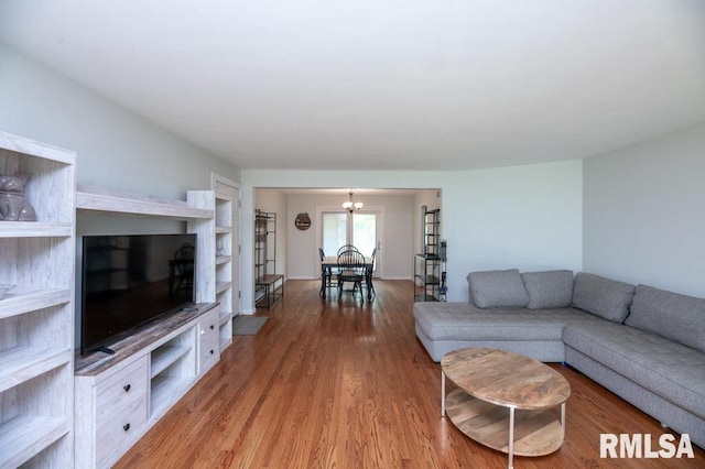 5232 N Merrimac Ave, Peoria, IL 61614 - living room with a chandelier and wood finished floors