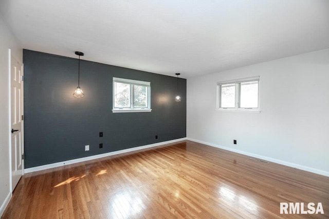 5232 N Merrimac Ave, Peoria, IL 61614 - empty room with wood finished floors and baseboards