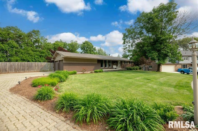 5232 N Merrimac Ave, Peoria, IL 61614 - view of front of property featuring an attached garage and driveway