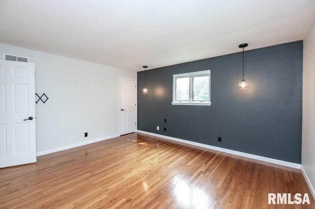 5232 N Merrimac Ave, Peoria, IL 61614 - empty room featuring light wood-style floors and baseboards